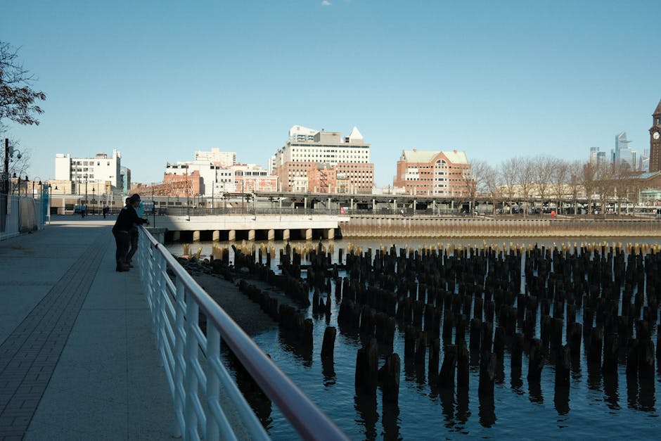 Explore the scenic Jersey City waterfront with this stunning view of the promenade and historic pier.